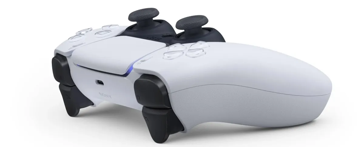 A white PlayStation 5 Dual Sense controller form the side view